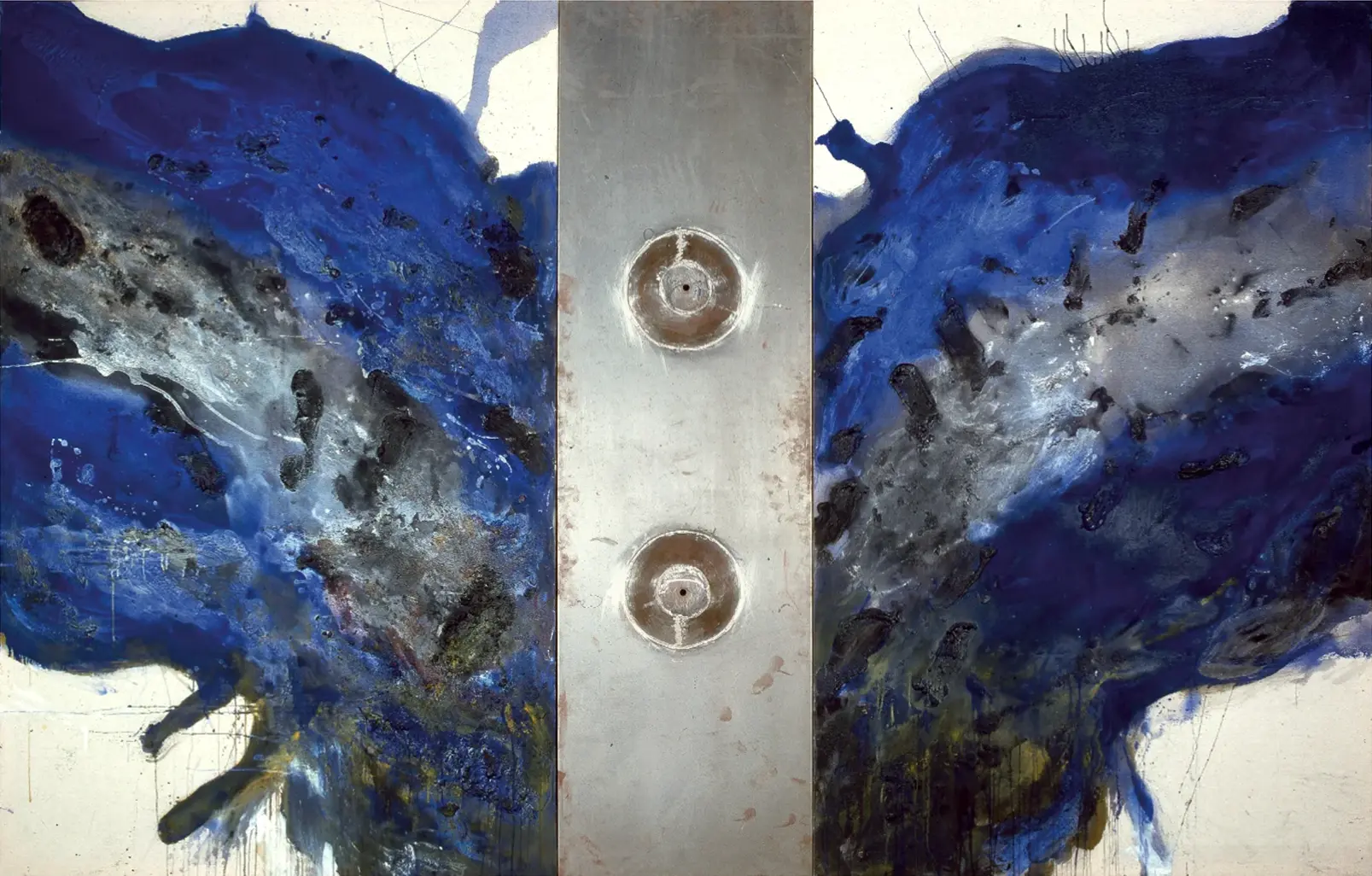 Contemporary artists Yiannis Fokas' artwork from 1991. Untitled. Triptych. 220 x 370 cm. Blue and black, mixed media techniques, a metal plate with 2 cone shapes with a hole in the middle. Matter, wild brushstrokes, and drips. Beige background color of canvas. Two wing shapes of blue and black various abstract forms shaped by brushstrokes and matter, the metal plate in the middle.